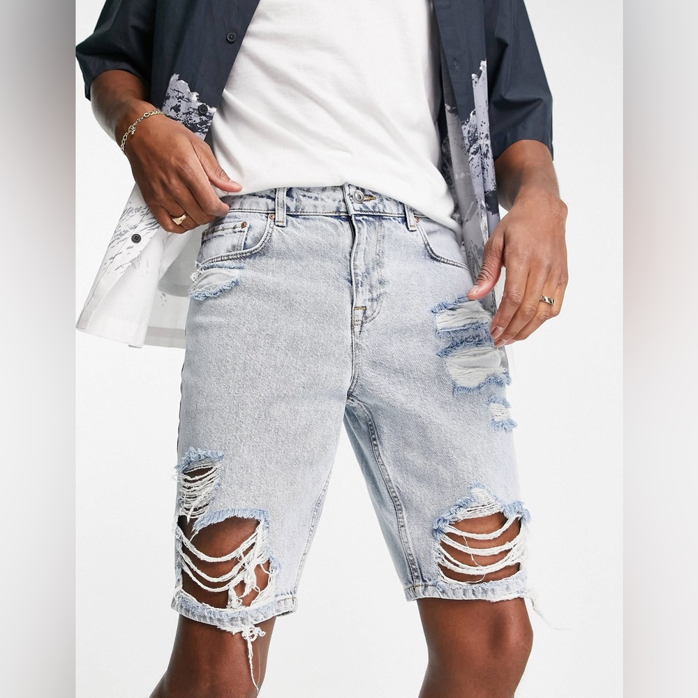 ASOS DESIGN slim denim shorts in light blue wash with heavy rips
